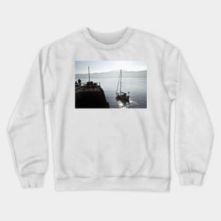 The yacht Ayesha heads out to sea from Scarborough, Yorkshire, UK Crewneck Sweatshirt